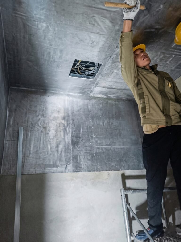 OSIDEK professional technician installing high-purity lead plates on walls and ceilings for a zero-leakage X-ray room radiation shielding project.